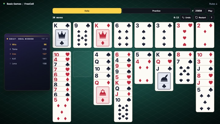 A game of FreeCell in play on a green table: eight columns of face-up cards, four free cells top left and four foundations top right